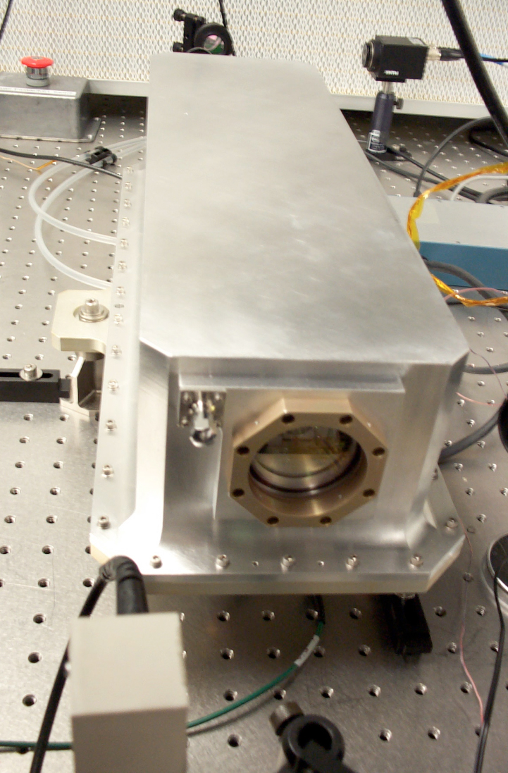 The bench top HOMER laser in an air-tight enclosure, from 2005. (Image credit: D. B. Coyle / NASA)