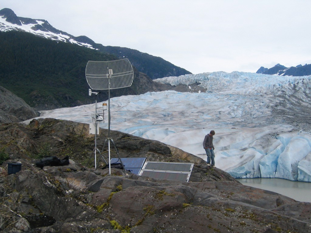A team member checks instrumentation on Lemon Creek Glacier (Credit: Matt Heavner)